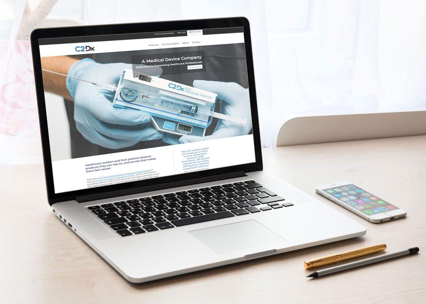 LKF Marketing Wins Hermes Award for C2 Dx Website website on laptop